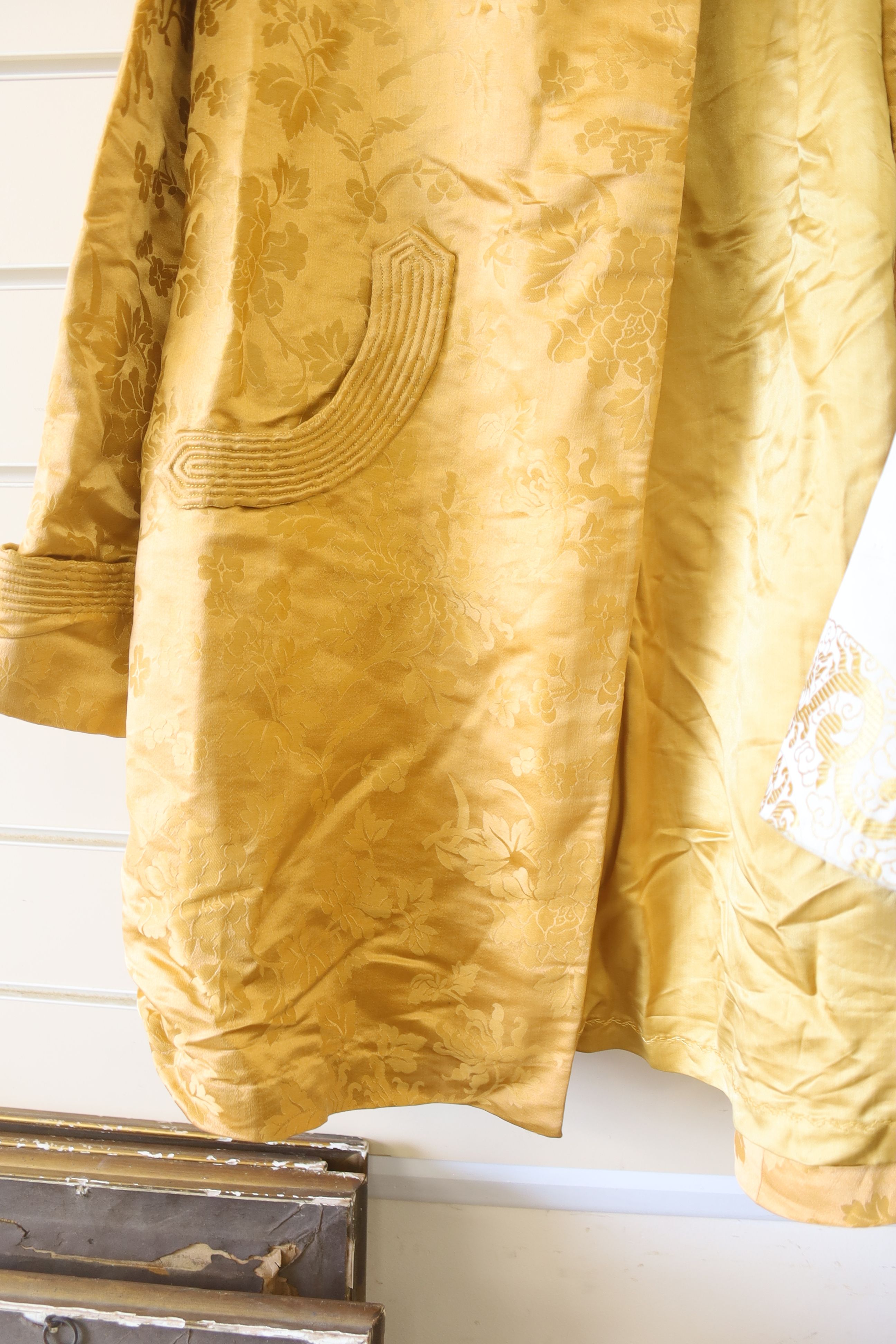 A 1940's Chinese yellow damask jacket, length 87cm, and a similar brocade jacket